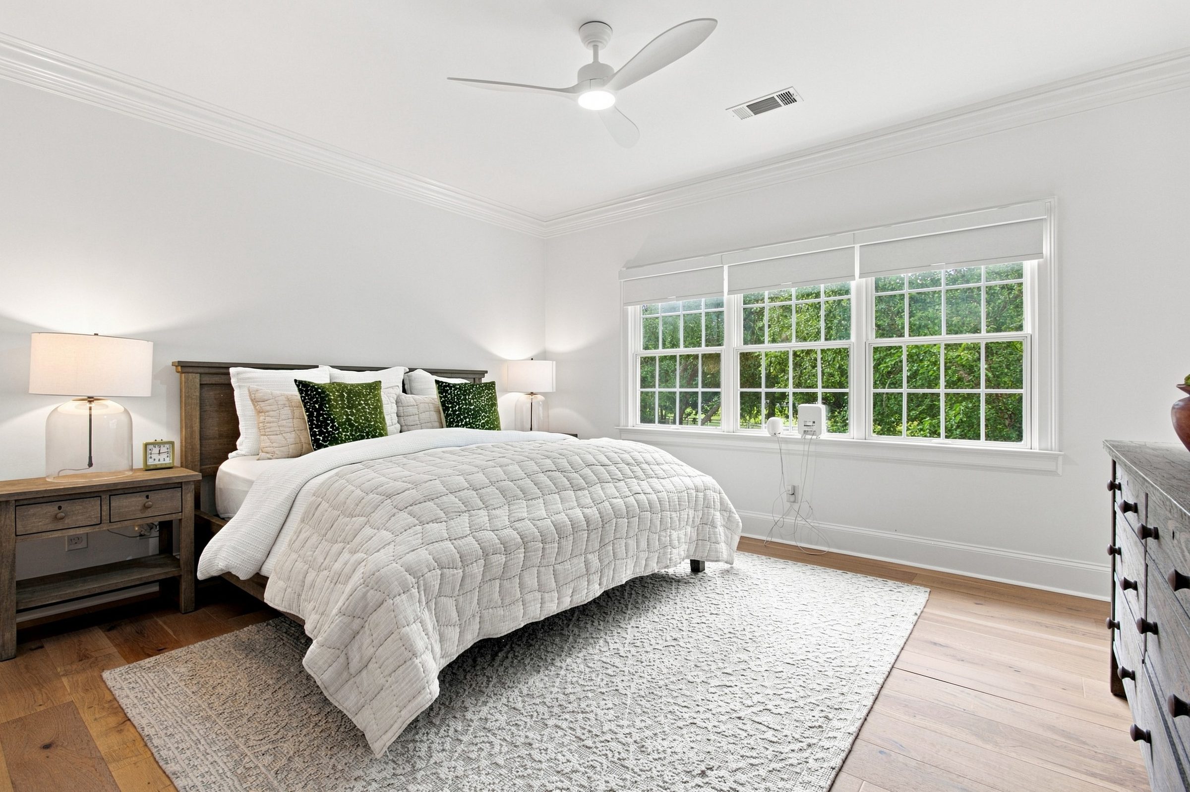 Primary bedroom with large windows